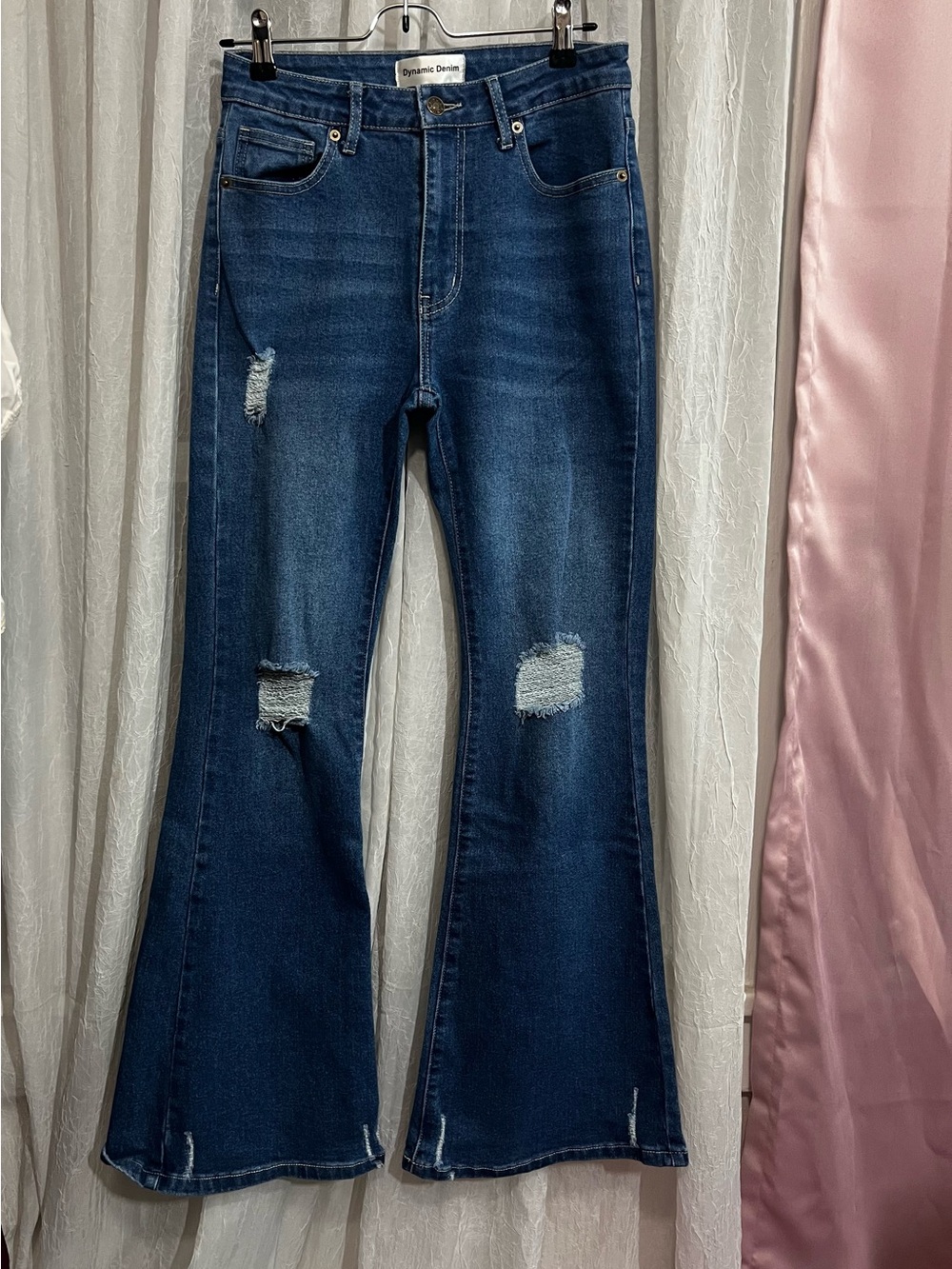 Dynamic Denim Women's Dark Blue Flare Jeans with Distressed Accents